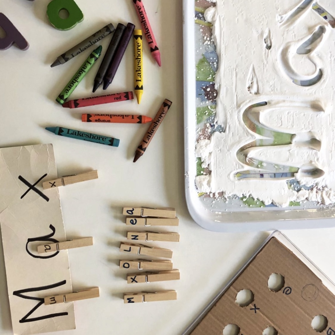 Crayons, letters, and learning tools for a fun alphabet and art activity at the Fun First Nursery.