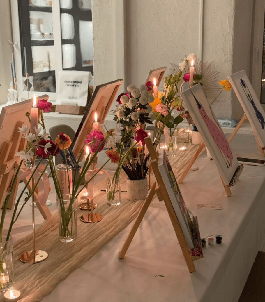 People engaging in a hands-on creative workshop at a cozy café.
